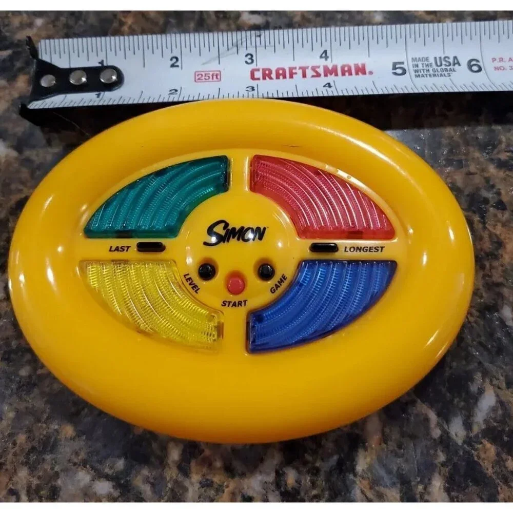 Simon Mini Game Yellow by Hasbro Mimic Memory Hand Held Electronic Game 2002